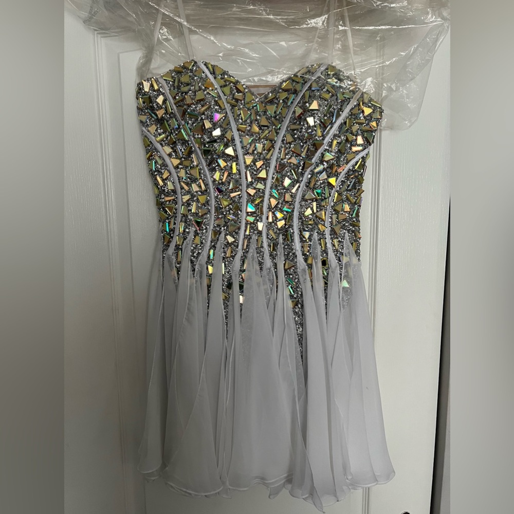 White dress size 6. Bought from high end boutique. Worn once for few hrs